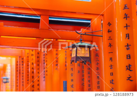 Lanterns and Red Torii Gate at Fushimi Inari Taisha Shrine in Kyoto, Japan. Lanterns and Red Torii Gate at Fushimi Inari Taisha Shrine in Kyoto, Japan. 128188973