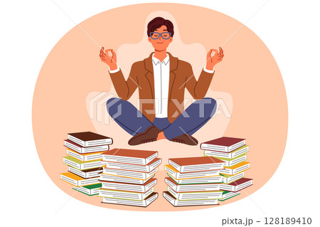 Man does yoga and meditation, taking break from reading books, levitating in lotus position Man does yoga and meditation, taking break from reading books, levitating in lotus position 128189410