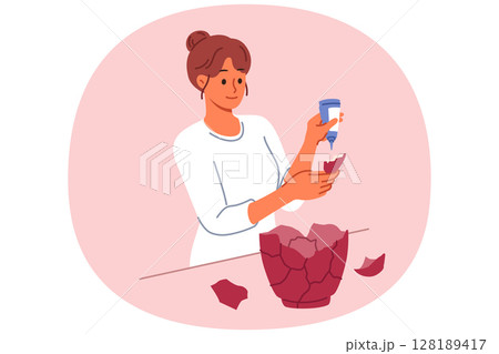 Woman restores old vase and uses glue to repair glass vessel that was damaged when it fell to ground Woman restores old vase and uses glue to repair glass vessel that was damaged when it fell to ground 128189417