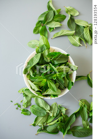 Fresh aromatic mint on minimalistic background from above 128193554