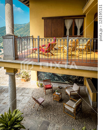 Elegant Italian Courtyard With Traditional Architecture: Cozy Outdoor Lounge And Balcony In A Lombardy Villa 128195131