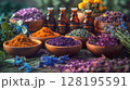 Assortment Of Colorful Spices And Dried Herbs In Wooden Bowls On Dark Stone Background: Aromatic Culinary Ingredients With Basil Leaves Cinnamon Sticks And Peppercorns Arranged For Cooking And Kitchen 128195591