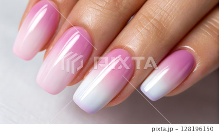 Ombre nail design featuring a gradient of pink and white shades on well-groomed hands 128196150