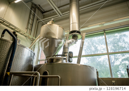 Modern stainless steel brewing equipment in craft brewery for beer production 128196714