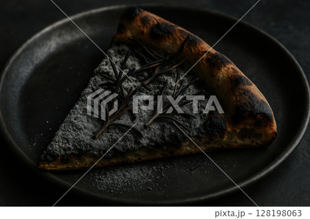 Charcoal crust pizza slice with rosemary herbs on plate, gourmet modern food trend highlighting unique flavors and dark presentation, AI Generative 128198063