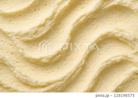 Smooth creamy butter swirls with soft texture and rich pale yellow color in a closeup food background, AI Generative 128198573