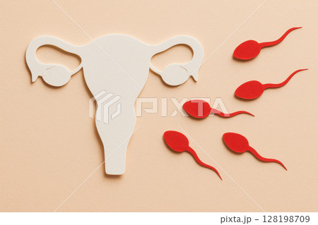 Paper cutout representation of human reproductive system with sperm cells approaching uterus on pastel background, symbolizing fertility, AI Generative 128198709