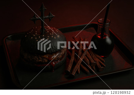 Gothic black burger with cross pick, dark sauce in bottle, and fries on tray under dramatic red moody lighting, AI Generative 128198932