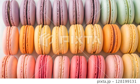 Colorful array of ombre macarons displayed neatly in a tempting dessert arrangement Colorful array of ombre macarons displayed neatly in a tempting dessert arrangement 128199131