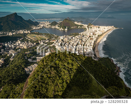 Stunning View From Two Brothers Hike In Rio De Janeiro: Coastal Cityscape With Ipanema Beach, Lagoa, And Ocean Horizon Seen From A Lush Mountain Overlook 128200328