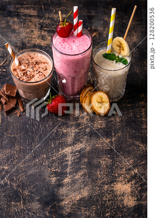 Milkshake from strawberry, banana and chocolate Milkshake from strawberry, banana and chocolate 128200536