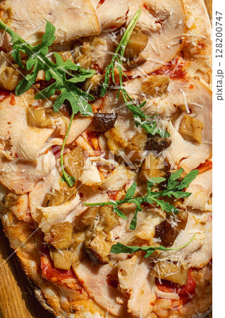 Pinsa with turkey porcini mushrooms and cheese 128200747