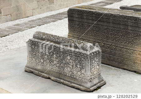 Intricate stone tombs featuring detailed carvings. Baku, Azerbaijan Intricate stone tombs featuring detailed carvings. Baku, Azerbaijan 128202529
