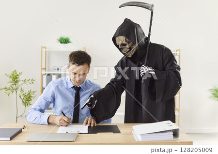 Man makes a deal with Death and puts a signature on a business contract agreement 128205009