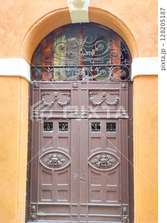Old medieval front door at Verona, Italy. Old medieval front door at Verona, Italy. 128205187
