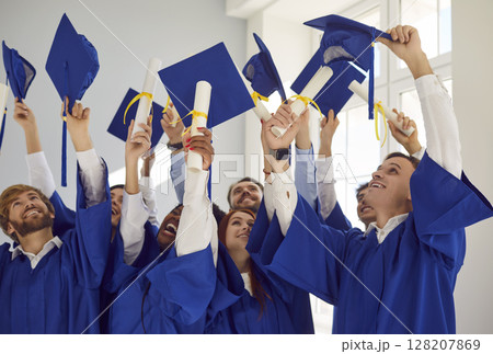 Graduation happy student ceremony formal event, young people wearing traditional academic dress 128207869