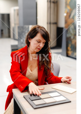 Interior designer choosing ceramic tiles for new project 128208067