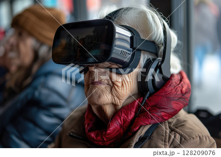 Elderly Woman Experiencing Virtual Reality Technology - Senior Using VR Headset and Headphones Indoors 128209076