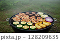Grill with chicken vegetables. Barbecue food prepared outdoor cookout. Summer picnic party healthy eating. Close-up realistic style blurred background 128209635