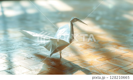 An elegant origami crane crafted from white paper, symbolizing peace and creativity in a serene setting. 128210665