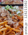 Hot Yaki Udon Noodles with Bonito Flakes and Scallions on a Sizzling Plate 128211082