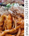 Hot Yaki Udon Noodles with Bonito Flakes and Scallions on a Sizzling Plate 128211084