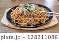 Hot Yaki Udon Noodles with Bonito Flakes and Scallions on a Sizzling Plate 128211086