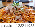 Hot Yaki Udon Noodles with Bonito Flakes and Scallions on a Sizzling Plate 128211088
