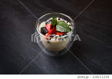 Dessert with Strawberry, Mint, and Cookie Crumble 128211258