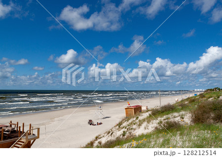 Curonian spit on a sunny summer day. Scenic view gray sand beach on the Baltic Sea coast in the village of Nida, Lithuania. 128212514