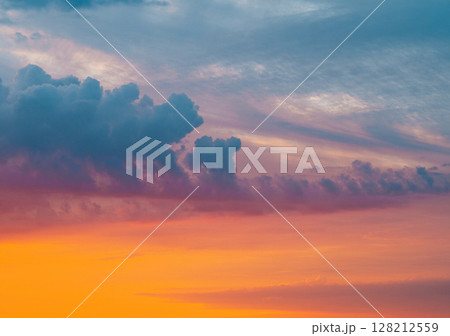 Clouds in the sunset sky. Dramatic cloudscape background. Clouds in the sunset sky. Dramatic cloudscape background. 128212559