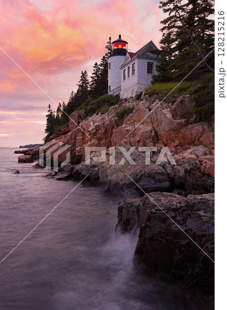Bass Harbour Lighthouse at sunset with dramatic rocks and Atlantic Ocean on the foreground, Acadia National Park, Maine, USA Bass Harbour Lighthouse at sunset with dramatic rocks and Atlantic Ocean on the foreground, Acadia National Park, Maine, USA 128215216