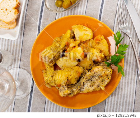 Baked chicken pieces with home-style stew potatoes for dinner Baked chicken pieces with home-style stew potatoes for dinner 128215948