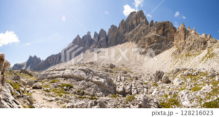 Paternkofel mountain in Italian Dolomites against blue sky with rare clouds. Paternkofel mountain in Italian Dolomites against blue sky with rare clouds. 128216023
