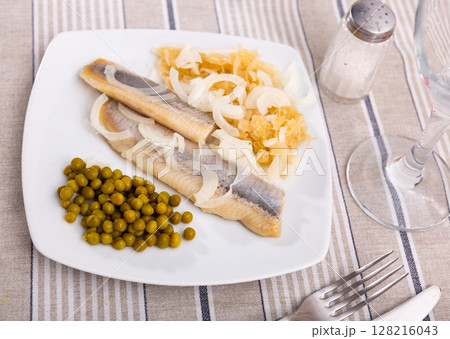 Light salted herring with marinated cabbage and green peas Light salted herring with marinated cabbage and green peas 128216043