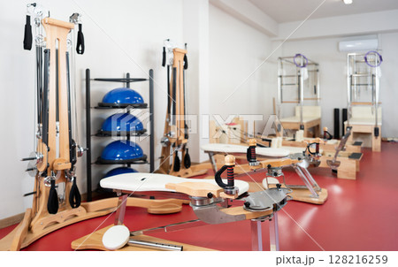 Equipment for Pilates -reformer bed, multifunctional bench, pilates apparatus with rope in gym 128216259