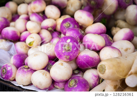 Turnip roots displayed for sale at greengrocery 128216361