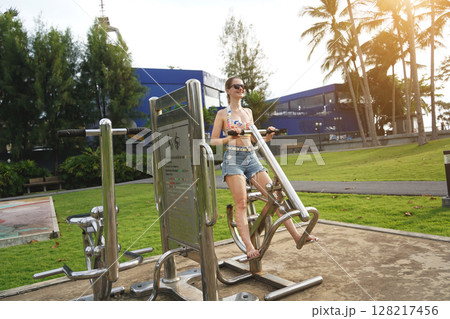 A young woman enjoying an workout outdoors A young woman enjoying an workout outdoors 128217456