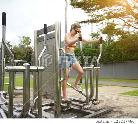 A young woman enjoying an workout outdoors A young woman enjoying an workout outdoors 128217466