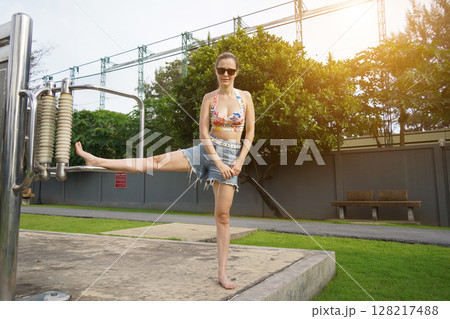 A young woman enjoying an workout outdoors A young woman enjoying an workout outdoors 128217488