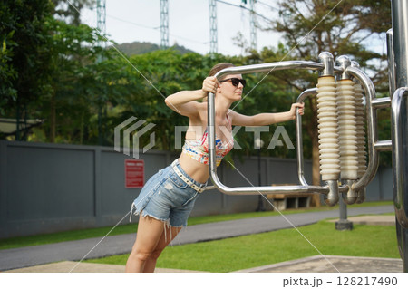 A young woman enjoying an workout outdoors A young woman enjoying an workout outdoors 128217490