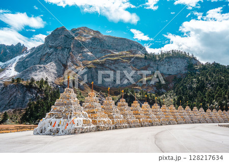 Row of White Shambhala Pagodas in a Himalayan Mountain Valley Row of White Shambhala Pagodas in a Himalayan Mountain Valley 128217634