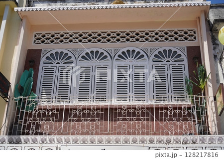 Detailed view of windows, doors and balconies of city buildings  128217816