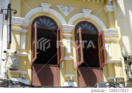 Detailed view of windows, doors and balconies of city buildings  128217817