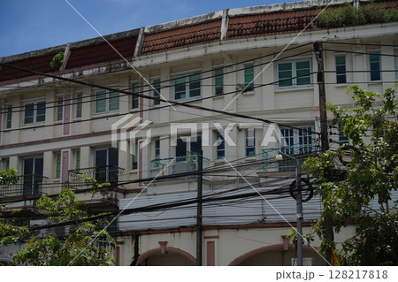 Detailed view of windows, doors and balconies of city buildings  128217818