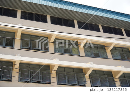 Detailed view of windows, doors and balconies of city buildings  128217826