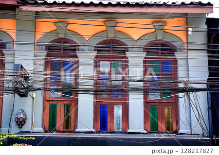 Detailed view of windows, doors and balconies of city buildings  128217827