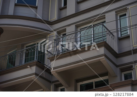 Detailed view of windows, doors and balconies of city buildings Detailed view of windows, doors and balconies of city buildings 128217884