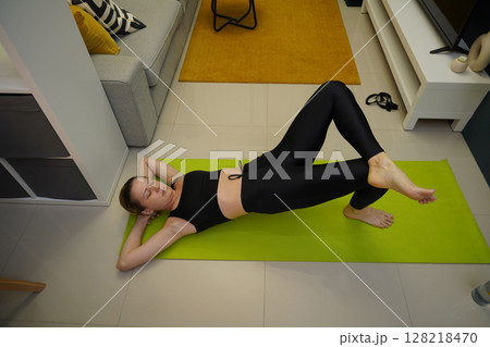 A young woman have a joyfully yoga practice  128218470