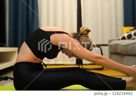 A young woman have a joyfully yoga practice A young woman have a joyfully yoga practice 128218482